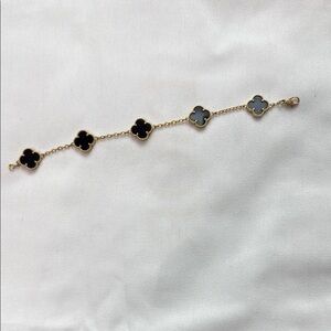 Elegant Gold and Black Clover Bracelet